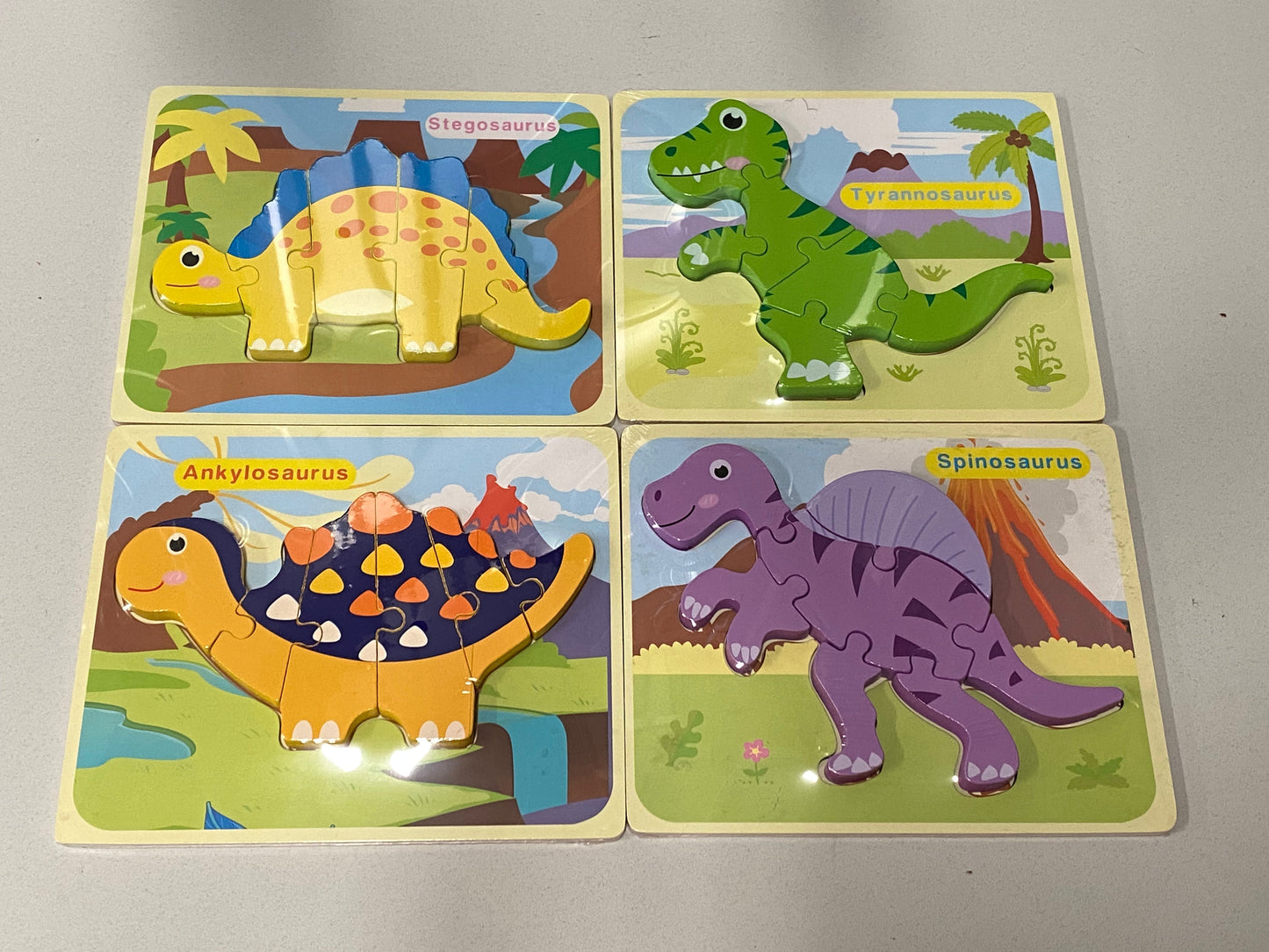 Juego de 4 rompecabezas de dinosaurios de madera